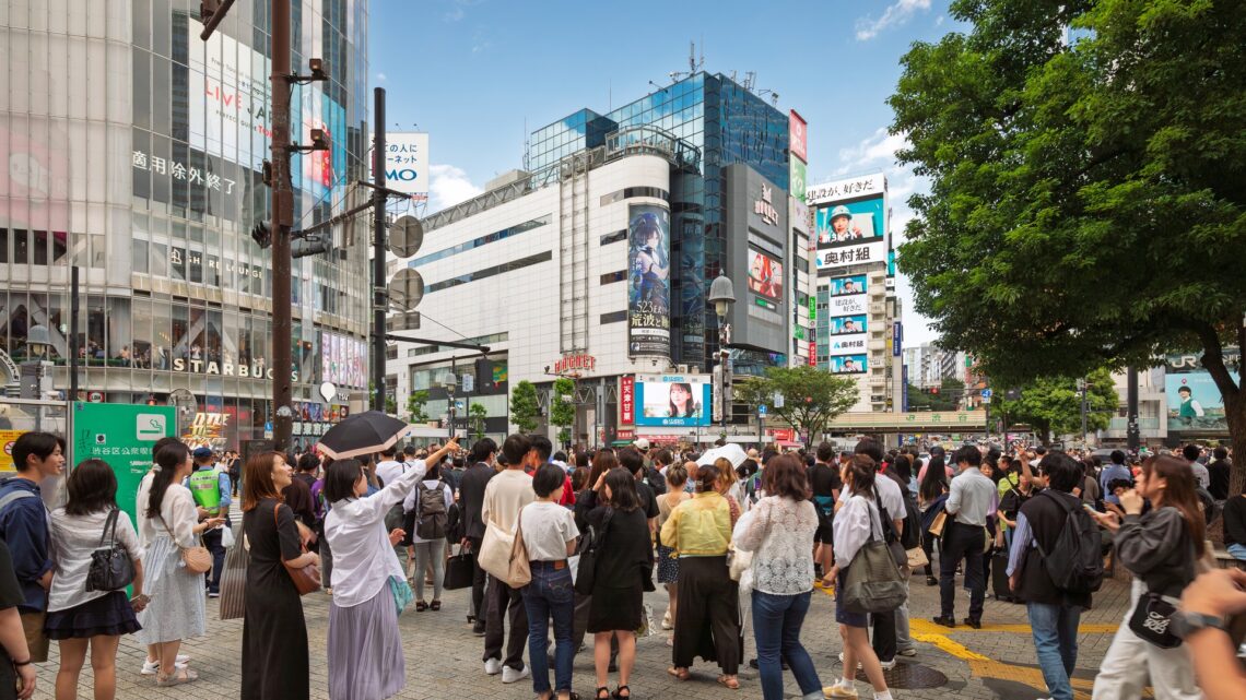 Crowd of people at Shibuya Crossing in Tokyo, illustrating a story about Japan's population, labor force and immigration policy debate
