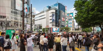 Crowd of people at Shibuya Crossing in Tokyo, illustrating a story about Japan's population, labor force and immigration policy debate