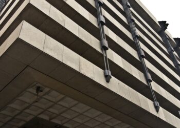 Upward view of the Central Bank of Ireland headquarters building facade in Dublin