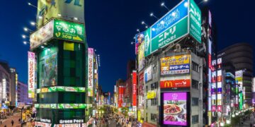 Night-time neon signage street scene in Tokyo's Shinjuku ward