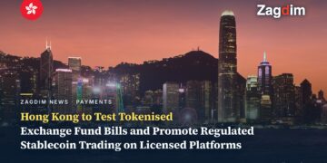 Central Hong Kong skyline at dusk across Victoria Harbour, with Two International Finance Centre rising on the right
