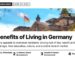 Landmark — Reichstag building facade with German flags framed by trees, illustrating The Benefits of Living in Germany