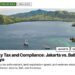 Aerial — Aerial view of Komodo island bay with boats, illustrating Property Tax and Compliance: Jakarta vs. Bali vs. Surabaya