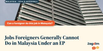 Low angle view of a striped high-rise office tower, illustrating Jobs Foreigners Generally Cannot Do in Malaysia Under an EP