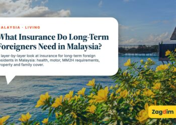 Calm sea with flowering bush and distant jetty, illustrating What Insurance Do Long-Term Foreigners Need in Malaysia?