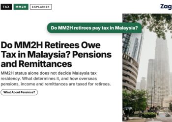 Kuala Lumpur street lined with skyscrapers and trees, illustrating Do MM2H Retirees Owe Tax in Malaysia? Pensions and Remittances
