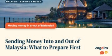Glass dome pavilion reflected in water at dusk, illustrating Sending Money Into and Out of Malaysia: What to Prepare First