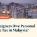 Penang skyline aerial view at dusk with high-rises, illustrating Do Foreigners Owe Personal Income Tax in Malaysia?