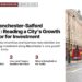 Oxford Street with red buses, illustrating The Manchester-Salford 'Smile': Reading a City's Growth Corridor for Investment