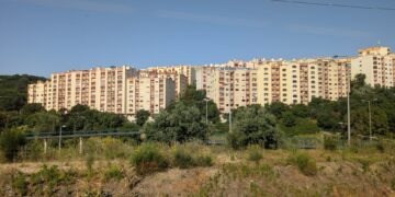 Mid-rise apartment blocks on a hillside on the outskirts of Lisbon