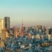 Tokyo skyline at golden hour with Tokyo Tower prominent among the high-rise towers of Minato ward