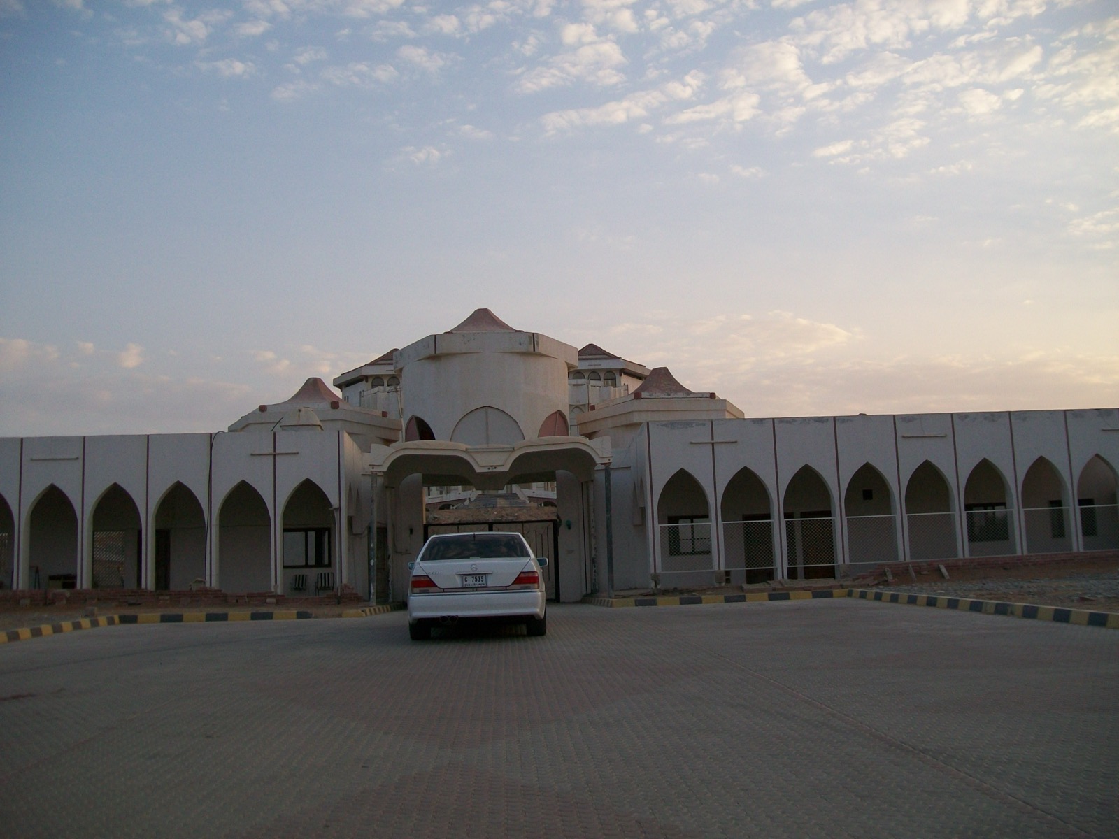 The gatehouse and arcaded outer wall of Al Qasimi Palace in Ras Al Khaimah