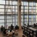 Interior of the Bank of Thailand Learning Center library, overlooking the Chao Phraya River and Rama VIII Bridge