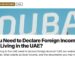 Landmark — Large illuminated DUBAI sign lettering close-up, illustrating Do You Need to Declare Foreign Income While Living in the UAE?