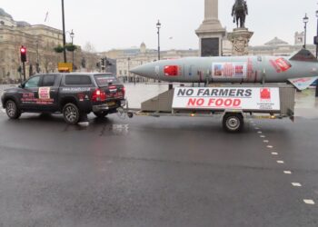 Mock missile trailer reading 'No Farmers No Food' towed through central London during a farmers' inheritance tax protest