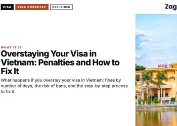 Architecture — Colonial yellow building reflected in water, illustrating Overstaying Your Visa in Vietnam: Penalties and How to Fix It