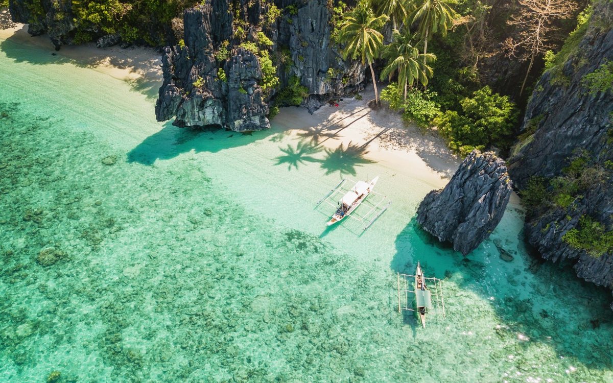 Aerial view of an El Nido lagoon beach in Palawan, the kind of island setting many SRRV retirees in the Philippines plan their long stay around