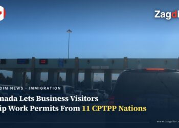 A Canadian port of entry checkpoint with vehicles queued for inspection