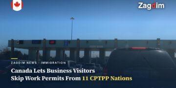 A Canadian port of entry checkpoint with vehicles queued for inspection
