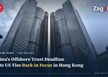 Upward view of Exchange Square's twin towers in Central, Hong Kong, home of the Hong Kong Stock Exchange, illustrating a story on China's offshore trust tax deadline and US tax exposure for Hong Kong asset holders