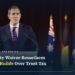 Australian Treasurer Jim Chalmers speaking at a lectern marked Australian Government, with the Australian flag behind him