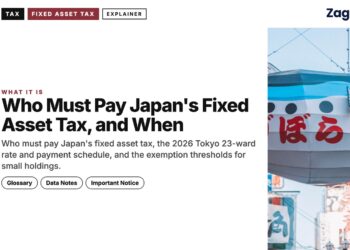 Giant fugu fish signboard on shopping street, illustrating Who Must Pay Japan's Fixed Asset Tax, and When