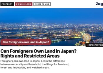 Night skyline of harbour city with ferris wheel, illustrating Can Foreigners Own Land in Japan? Rights and Restricted Areas