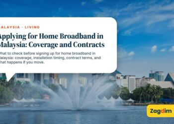 Petronas Towers with fountain display in daytime, illustrating Applying for Home Broadband in Malaysia: Coverage and Contracts