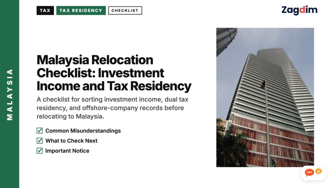 Low angle view of a striped high-rise office tower, illustrating Malaysia Relocation Checklist: Investment Income and Tax Residency