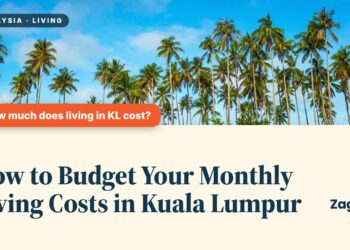 Tall palm trees against a blue sky, illustrating How to Budget Your Monthly Living Costs in Kuala Lumpur