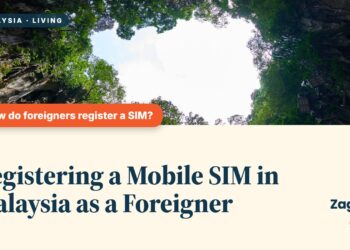 Natural cave opening framed by rock with greenery beyond, illustrating Registering a Mobile SIM in Malaysia as a Foreigner