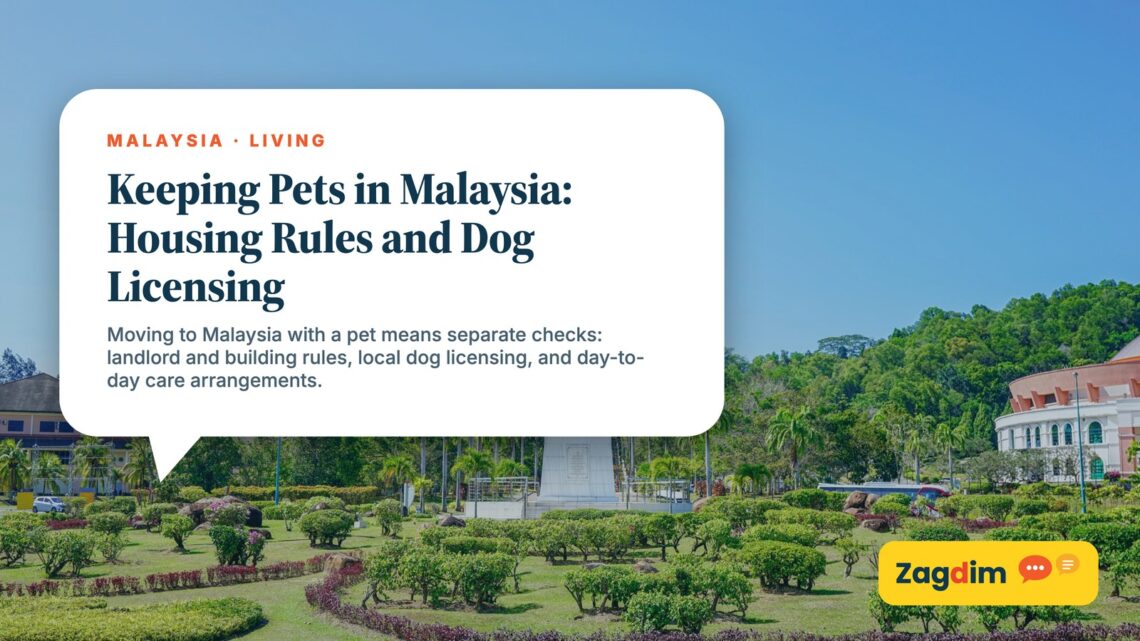 White clock tower monument in landscaped park gardens, illustrating Keeping Pets in Malaysia: Housing Rules and Dog Licensing