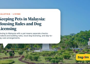 White clock tower monument in landscaped park gardens, illustrating Keeping Pets in Malaysia: Housing Rules and Dog Licensing