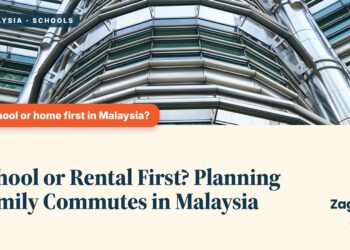 Upward view of a single Petronas Tower, illustrating School or Rental First? Planning Family Commutes in Malaysia