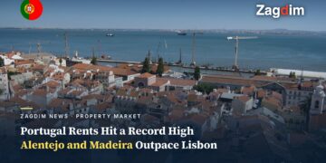 Red-tiled rooftops of Lisbon's Alfama district overlooking the Tagus river, Portugal rents hit record high