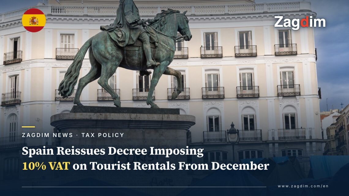 Equestrian statue of Carlos III in Madrid Puerta del Sol, its base spray-painted TOURIST GO HOME, with a housing-protest tent camp behind it