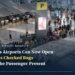 Passengers queue with luggage at the international check-in area of Bangkok's Suvarnabhumi Airport