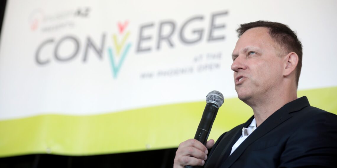 Peter Thiel speaking into a microphone at a public event