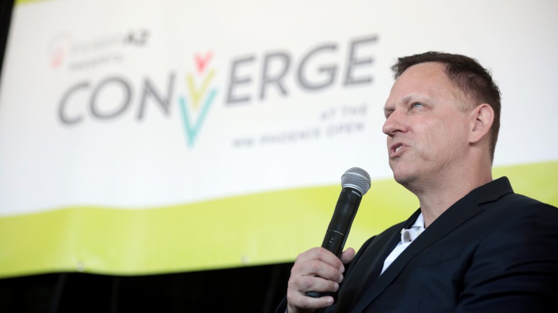 Peter Thiel speaking into a microphone at a public event