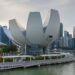 ArtScience Museum, Marina Bay Sands, in the late afternoon, in front of the skyline of the Central Business District, Singapore. Architect : Moshe Safdie.