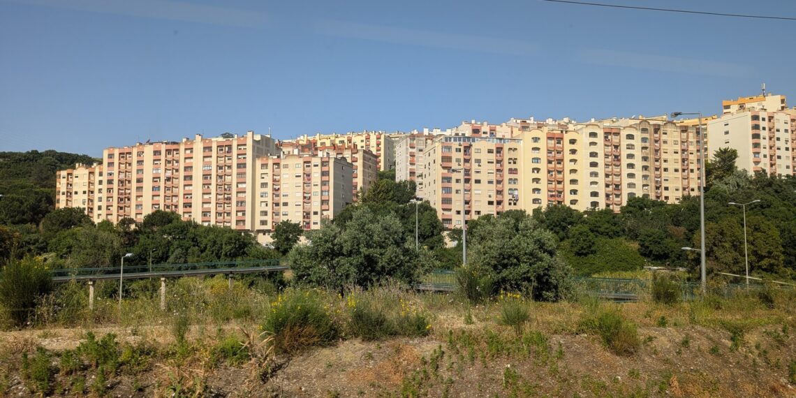 Mid-rise apartment blocks on a hillside on the outskirts of Lisbon
