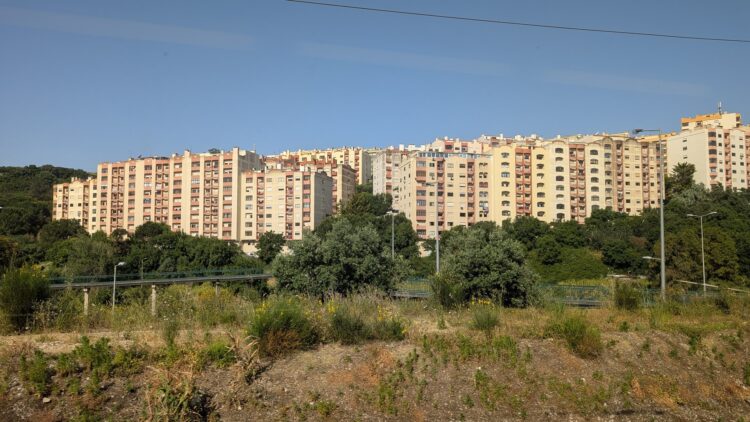 Mid-rise apartment blocks on a hillside on the outskirts of Lisbon