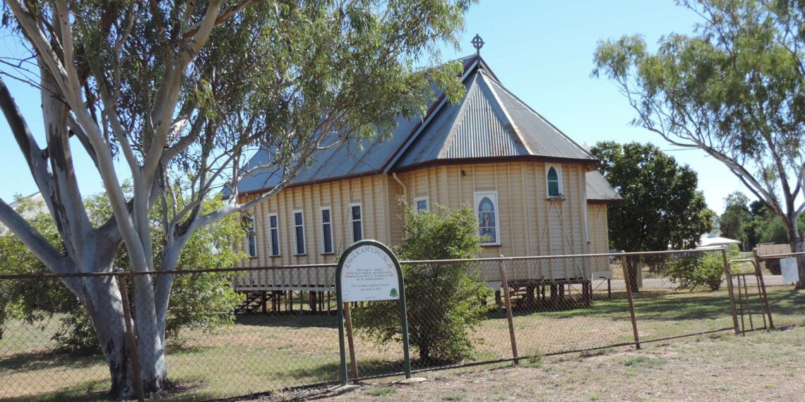 Small timber Anglican church in the regional Queensland outback town of Aramac, one of the towns named in the story's regional-yields example