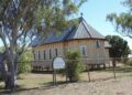 Small timber Anglican church in the regional Queensland outback town of Aramac, one of the towns named in the story's regional-yields example